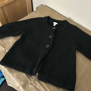 Chico’s size 1 black short sleeve cardigan with buttons.